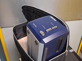 a suitcase with a blue and silver electronic device inside of it