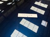 a picture of a sign on the floor of a building