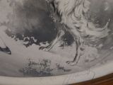 a drawing of a dog in a bowl on a table