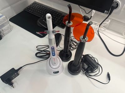 a desk with a keyboard, mouse, headphones, and a monitor
