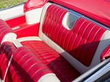 an image of a red and white car with leather seats