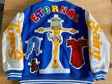 blue and white jacket with a cross on the front and a cross on the back
