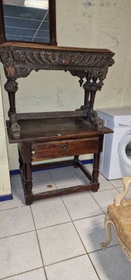a chair that is next to a washer in a room
