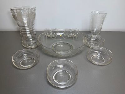 a lot of glasses and a bowl on the table