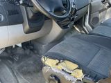 the interior of a car with a broken steering wheel and a dirty seat