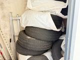 a lot of tires stacked on top of each other