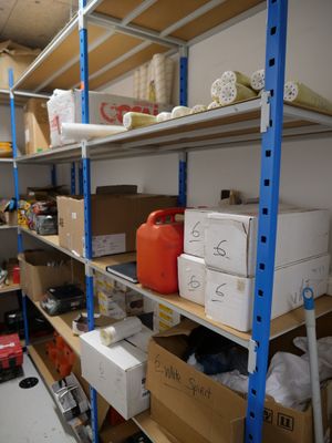 a room filled with lots of boxes and shelves