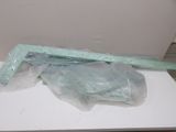 a white table with plastic bags on it and a knife on top of it