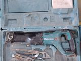 a blue tool case with tools in it on the floor