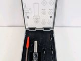 a box with tools in it on a white surface