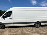 the white van is parked on the side of the road