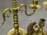 brass candlesticks with horse figurines and a horse figurine