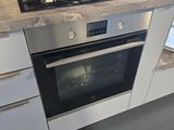 a stove and oven in a kitchen with a counter top