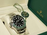a watch in a box with a chain around it