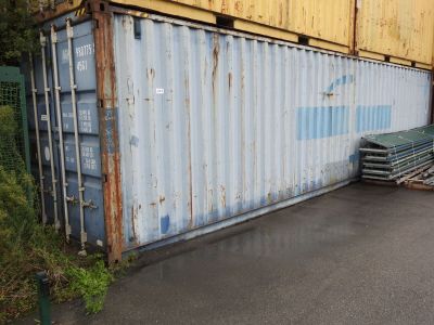 a large container that is sitting on the side of the road