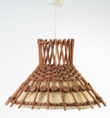 a lamp that is made out of sticks and wood