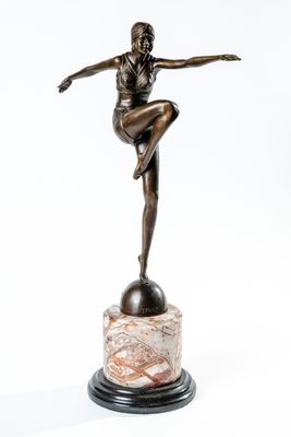 bronze statue of a female dancer on a marble base