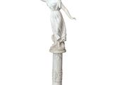 an image of a statue of a woman standing on top of a column