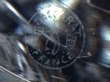 a close up of a glass of water with a stamp on it
