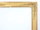 an old gold frame with a white background and a white wall
