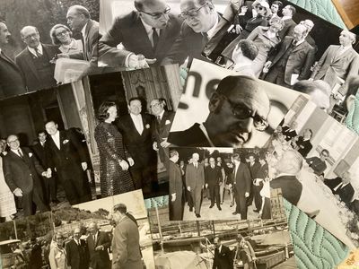 several old black and white photos of men in suits and ties