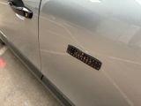 a close up of a car door with a sticker on it
