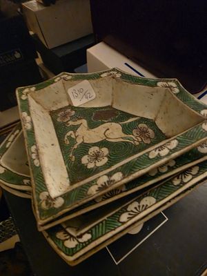 four plates stacked on top of each other on a table