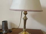 a lamp that is on top of a wooden table