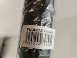 a close up of a piece of black fabric with a barcode on it
