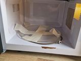 a microwave that has some toilet paper in it