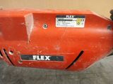 an image of a close up of a red electric drill