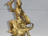bronze statue of a man with a harp on a marble base