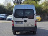 a silver van that is parked in a parking lot