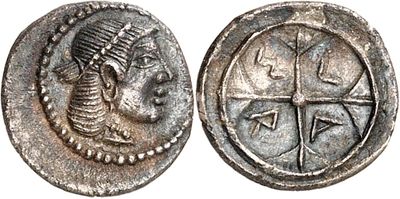 a silver coin with an image of a woman and a cross on it