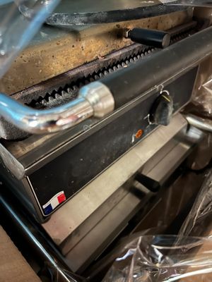 a close up of a stove with a pan on top of it