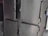 a man that is standing in front of a large oven