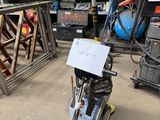 a machine that is sitting in a garage next to other machines