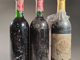 three bottles of wine sitting next to each other on a table