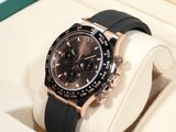 a black and rose gold watch in a box