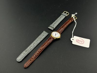 EMILE PEQUIGNET : montre bracelet de dame en métal doré, cad…