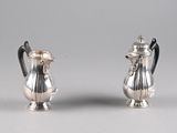 pair of silver plated sugar and pepper shakers