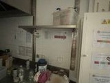 an image of a kitchen with a lot of clutter on the counter