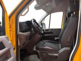 a yellow truck with the door open and the driver ' s seat down