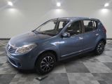 a picture of a small blue car parked in a garage
