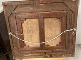 a picture of an old wooden easel with a rope on it