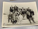a group of people sitting on a bench together