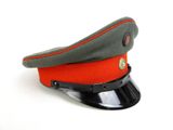 grey and orange military hat on a white surface