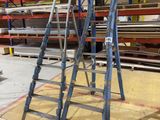 a ladder that is sitting in the middle of a room