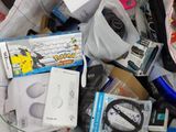 a bag full of electronics and other items on the floor