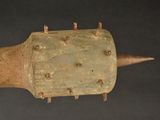 an image of a wooden object with spikes on it